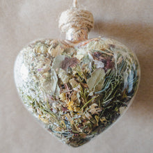 Load image into Gallery viewer, Large glass heart filled with dried areca palm, white rose petals, chrysanthemum buds, baby&#39;s breath and orange lily.
