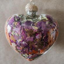 Load image into Gallery viewer, Large (3.5 inches wide by 4 inches tall) glass heart filled with dried orange lilies, pink rose petals, baby&#39;s breath and devil&#39;s ivy flower.
