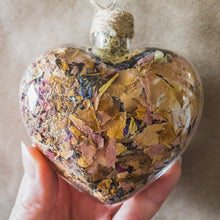 Load image into Gallery viewer, Large (3.5 inches wide by 4 inches tall) glass heart filled with dark purple orchids, lavender, pink rose petals and rosebuds.
