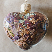 Load image into Gallery viewer, Large (3.5&quot; wide x 4&quot; tall) glass heart filled with rose gold lilies, red rose petals and blue hydrangeas.
