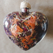 Load image into Gallery viewer, Large (3.5&quot; wide x 4&quot; tall) glass heart filled with red rose petals, pink carnation petals, orange and white lilies.
