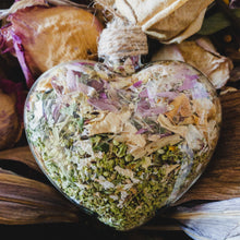 Load image into Gallery viewer, 3.5&quot; wide x 4&quot; tall glass heart filled with dried pink strawflower, white roses and green hydrangea.
