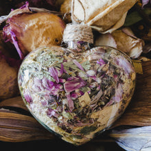 Load image into Gallery viewer, 3.5&quot; wide x 4&quot; tall glass heart filled with dried pink strawflower, white roses and green hydrangea.
